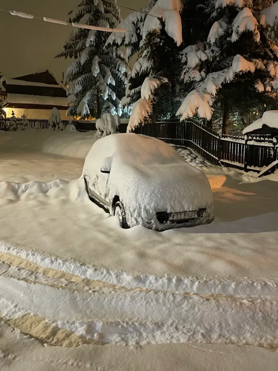Car buried in snow