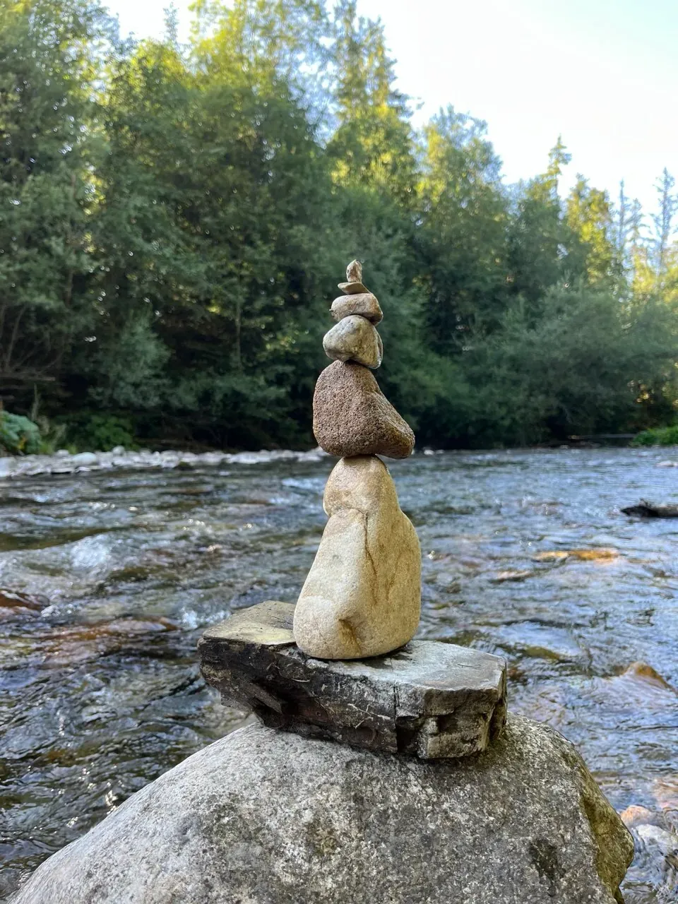 Stone stacks by the stream